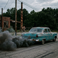 image showing an old car belching smoke from the exhaust